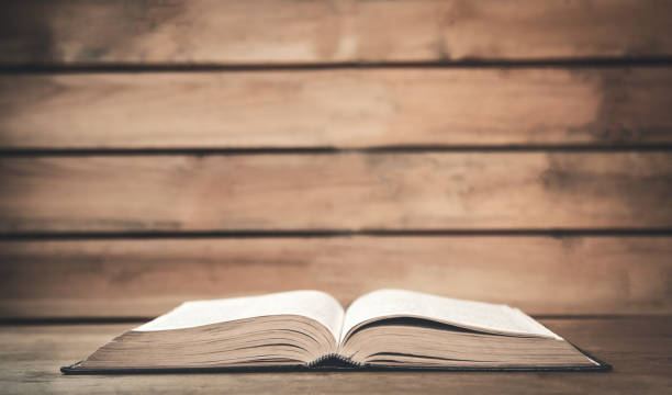 istock Bible on a wood background. 916048788