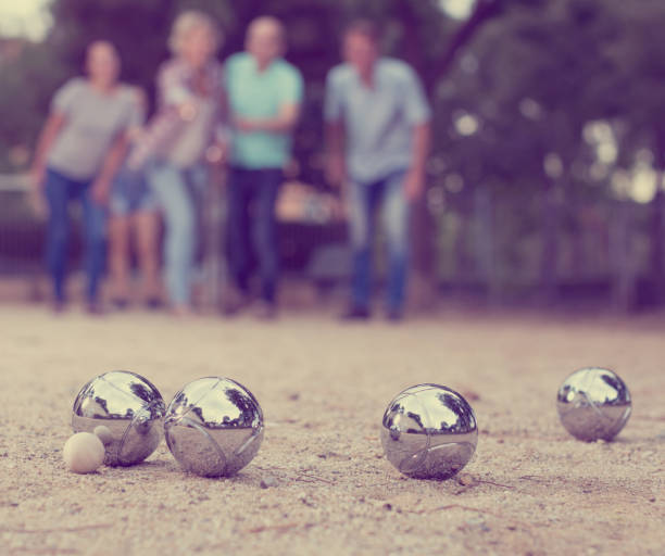 istock people playing petanque at leisure 916049140