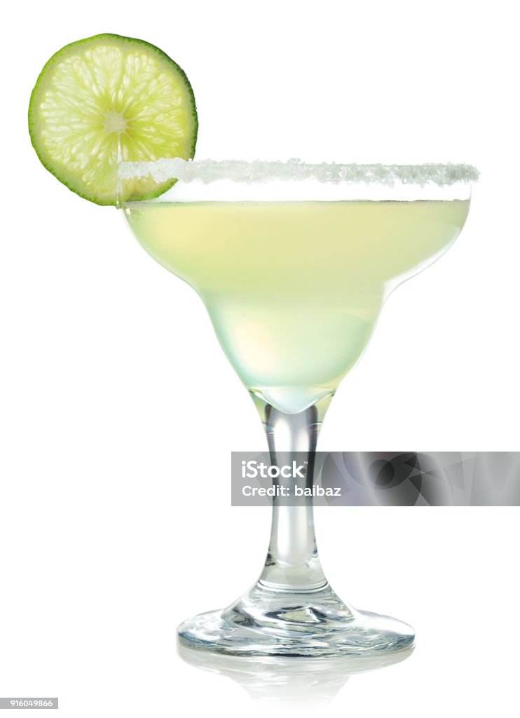 Classic margarita cocktail with lime Glass of classic margarita cocktail decorated with slice of lime isolated on white background Margarita Stock Photo