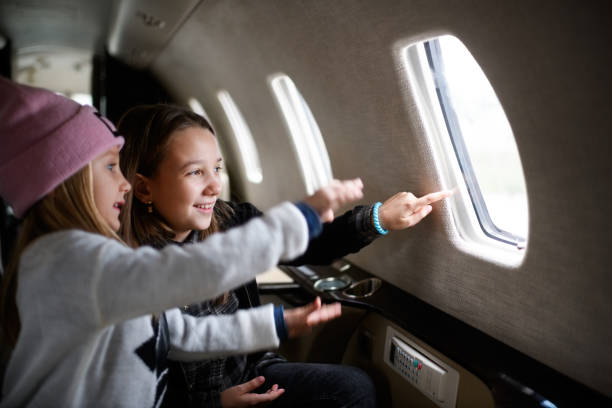 istock Girls in the airplane 916052984