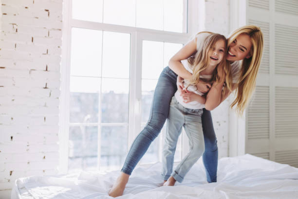 Mom and daughter having fun at home