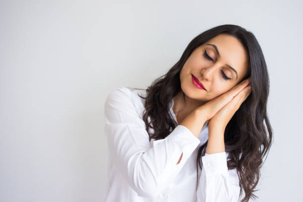 istock Content Pretty Woman Making Sleep Gesture 916057812