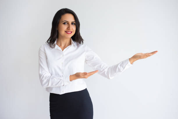 istock Woman Holding and Pointing at Empty Space on Palm 916059146