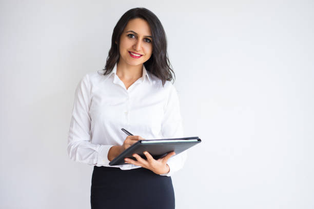 istock Happy successful businesswoman working with report 916060028