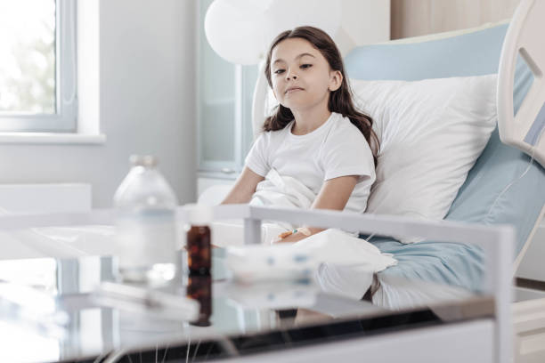 istock Curious child analyzing medications in hospital 916060626