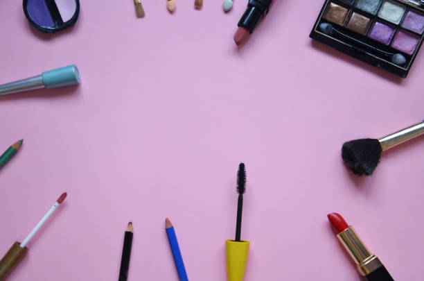 istock Make up bag, brush with cosmetics on pink background 916060656