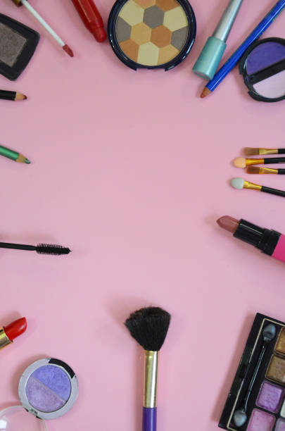 istock Make up bag, brush with cosmetics on pink background 916061082