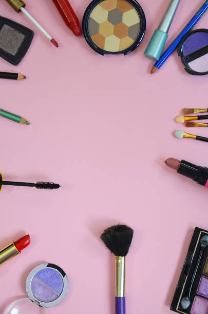 istock Make up bag, brush with cosmetics on pink background 916061136