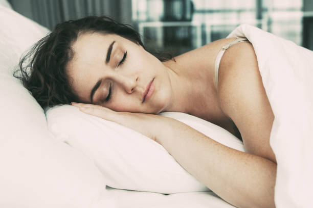 istock Middle-aged Lovely Woman Sleeping in Bed 916064716