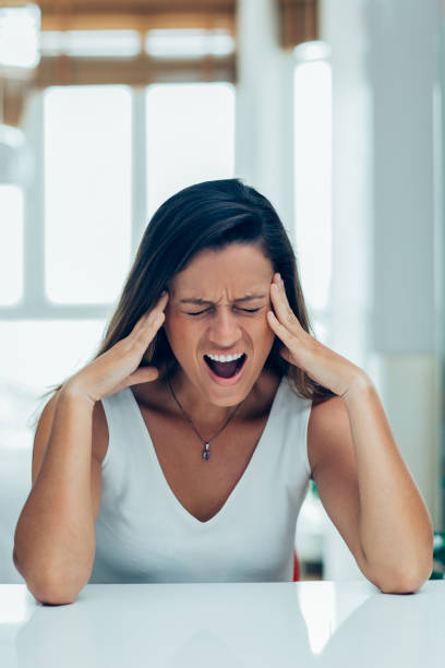 istock Stressful young woman crying from pain 916064914
