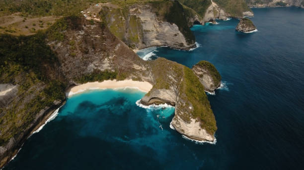 istock Rocky cliff with beach in the sea. Karang Dawa 916064944