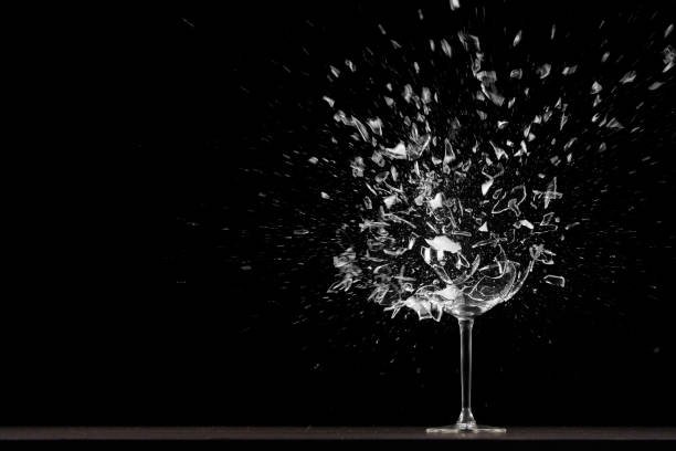 Wing glass explodes The glass is placed in a dark room slow motion photos stock pictures, royalty-free photos & images