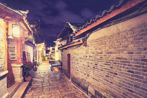 Color toned picture of the Old town of Lijiang at night, China.