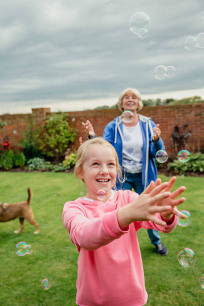 istock Playing with Bubbles in the Garden 916071296