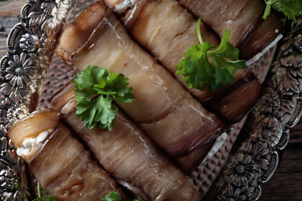 istock Eggplant rolls stuffed with cheese and garlic. 916072530