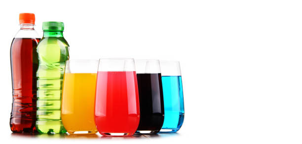 istock Glasses and bottles of assorted carbonated soft drinks 916072666