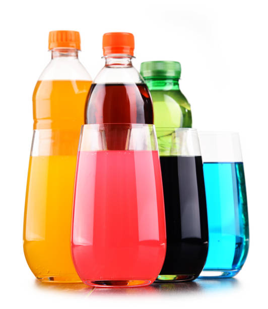 istock Glasses and bottles of assorted carbonated soft drinks 916075516