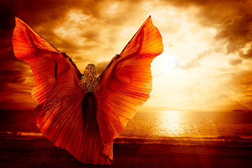 Woman Dancing Wings Dress, Fashion Art Model Flying on Ocean Sky Sunset, Beauty Imagination Concept