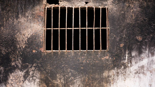 istock Iron window, dirty black color wall 916079914