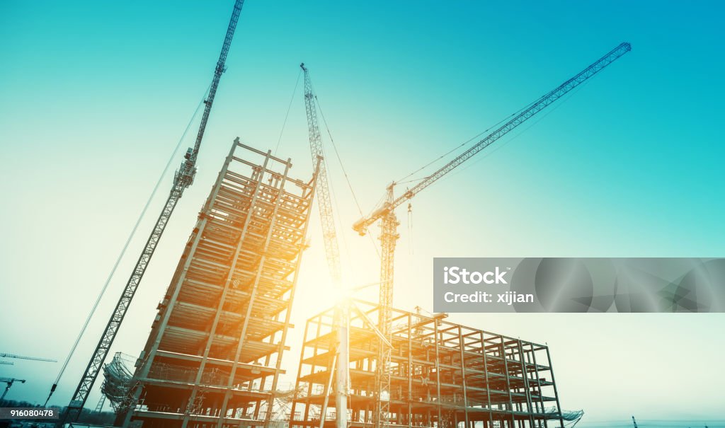 Industrial construction cranes Construction Site Stock Photo