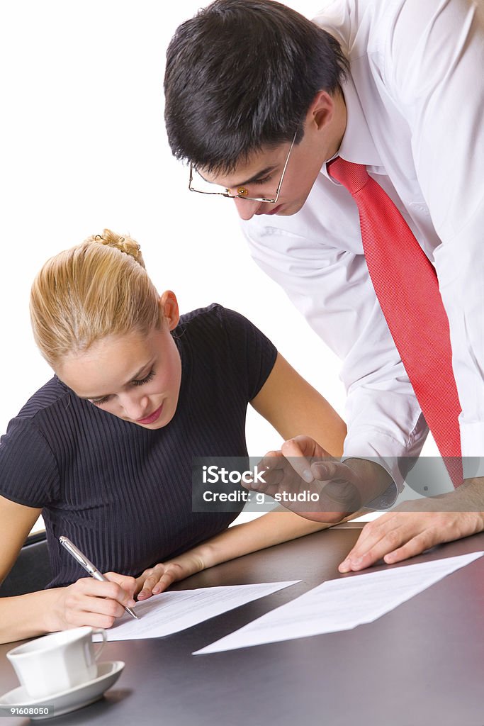 Two young successful business people working, isolated  Adult Stock Photo