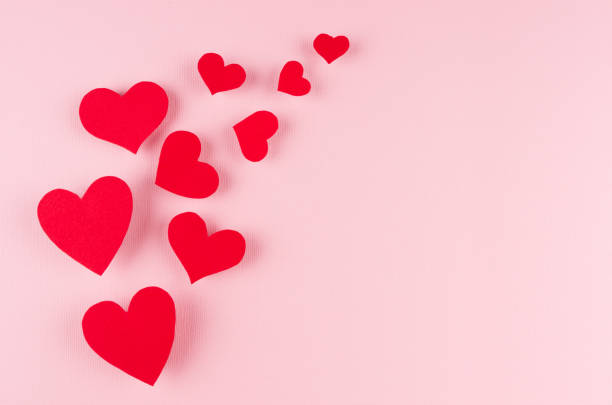 istock Red paper hearts soar on pink color background, copy space. Valentines day backdrop. 916080918