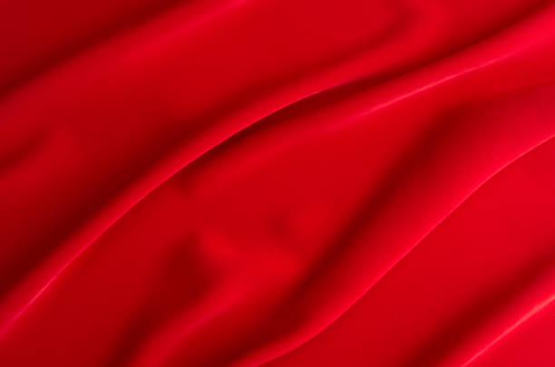 istock Red silk wavy background. Passion backdrop for Valentines day. 916083730