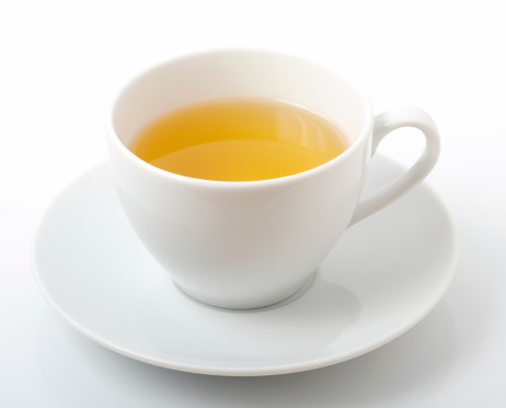 Cup of green tea on white background