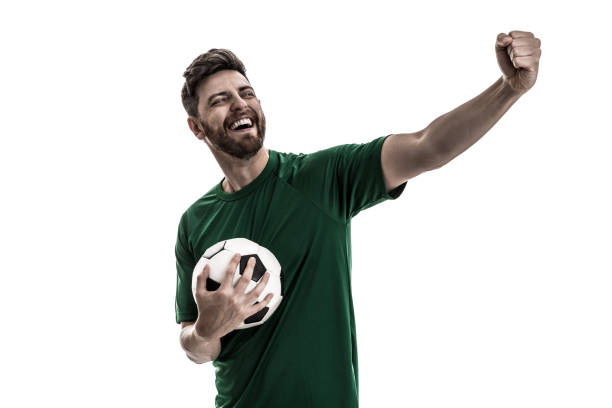istock Fan / Sport Player on green uniform celebrating 916084670