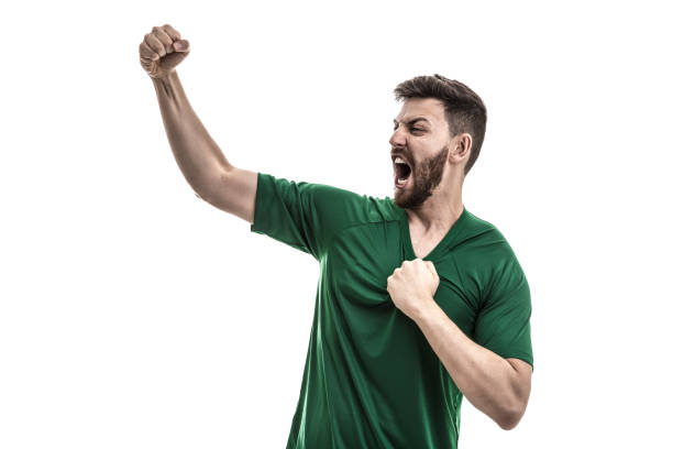 istock Fan / Sport Player on green uniform celebrating 916084678