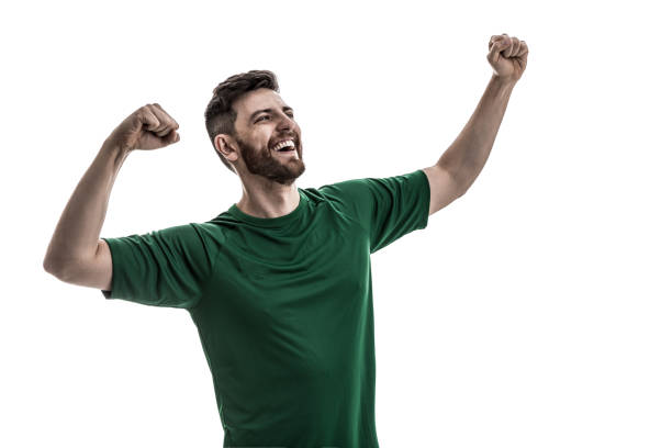 istock Fan / Sport Player on green uniform celebrating 916084686