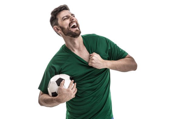 istock Fan / Sport Player on green uniform celebrating 916084692