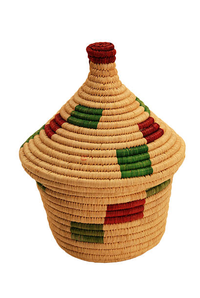 African Basket with Red and Green against White Background stock photo