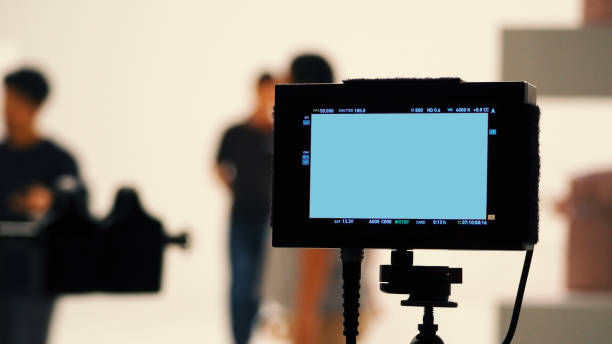 Behind video production digital view screen monitor Behind video production digital view screen monitor from movie shooting camera in the studio. crew photos stock pictures, royalty-free photos & images