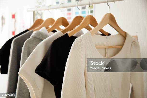 Women Clothes Hanging On Hangers Clothing Rails Fashion Design Stock Photo - Download Image Now