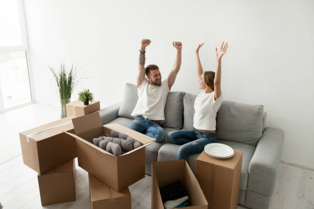 istock Euphoric young couple feeling happy about moving in new home 916092502