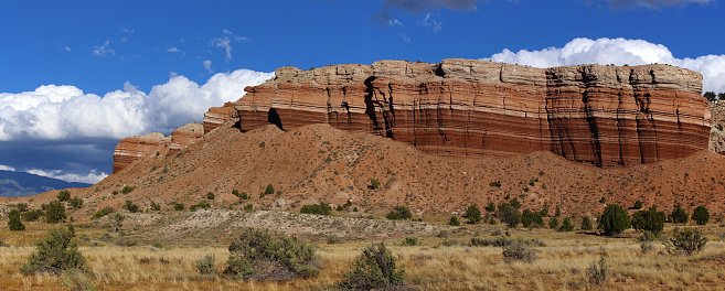 Sedimentary rocks (Jurassic Curtis Formation on top of brown strata of the Summerville Formation) on the east side of the Capitol Reef Monocline, Utah, USA