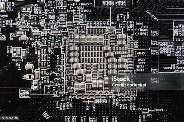 Ceramic Capacitors At Digital Electronic Circuit Board Closeup Very Small Type Stock Photo - Download Image Now