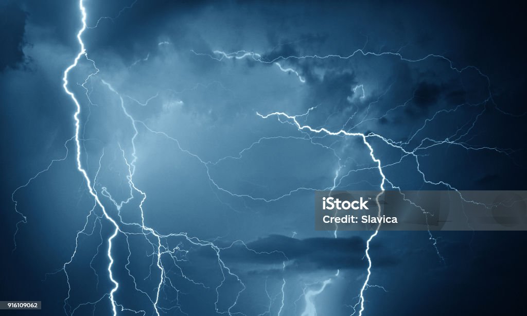 Thunder, lightning and rain Lightning during storm on dark summer night. Lightning Stock Photo