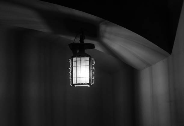The old and vintage lantern in dark room.