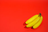 yellow banana, red background