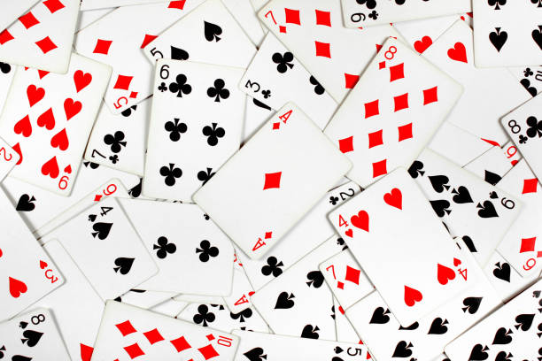 istock Red and black playing cards as background 916115646