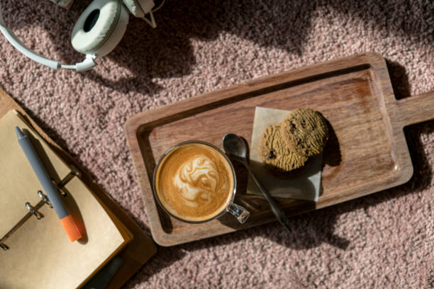 istock coffee break: cookies, espresso coffee and earphone 916116056