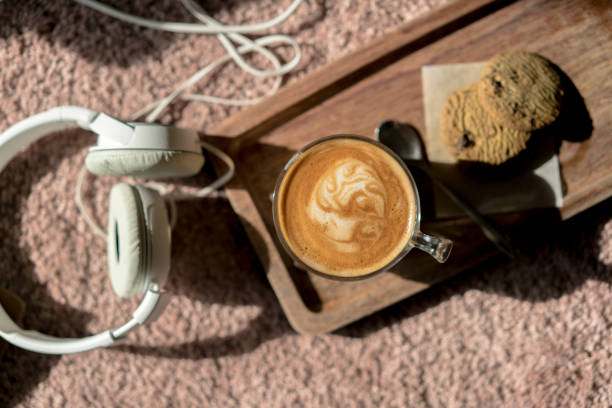istock coffee break: cookies, espresso coffee and earphone 916116220