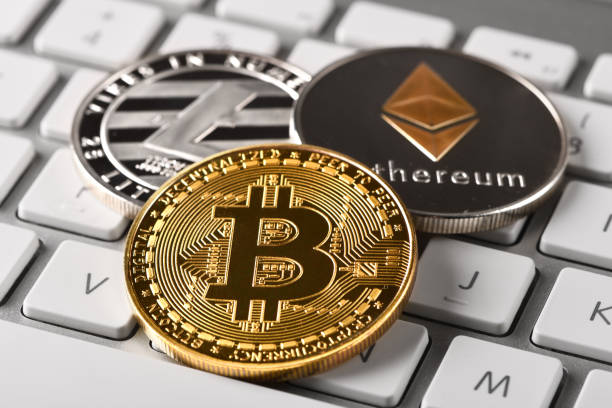 Bitcoin Litecoin and Ethereum İstanbul, Turkey - February 7, 2018: Close up shot of Bitcoin, Litecoin and Ethereum memorial coins on a computer keyboard. Bitcoin, Litecoin and Ethereum are crypto currencies and a worldwide payment system. litecoin stock pictures, royalty-free photos & images