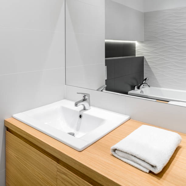 istock New bathroom with wooden cabinet 916117716