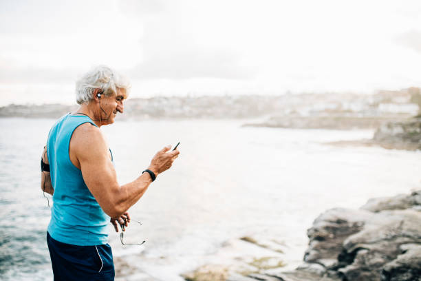 istock Active senior man with smart phone 916124858