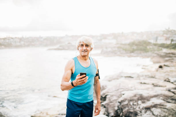 istock Active senior man with smart phone 916124970