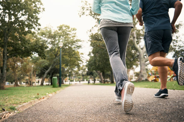 Rearview shot of a senior couple out for a run in the park