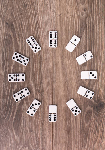 istock Clock face made of domino 916125578